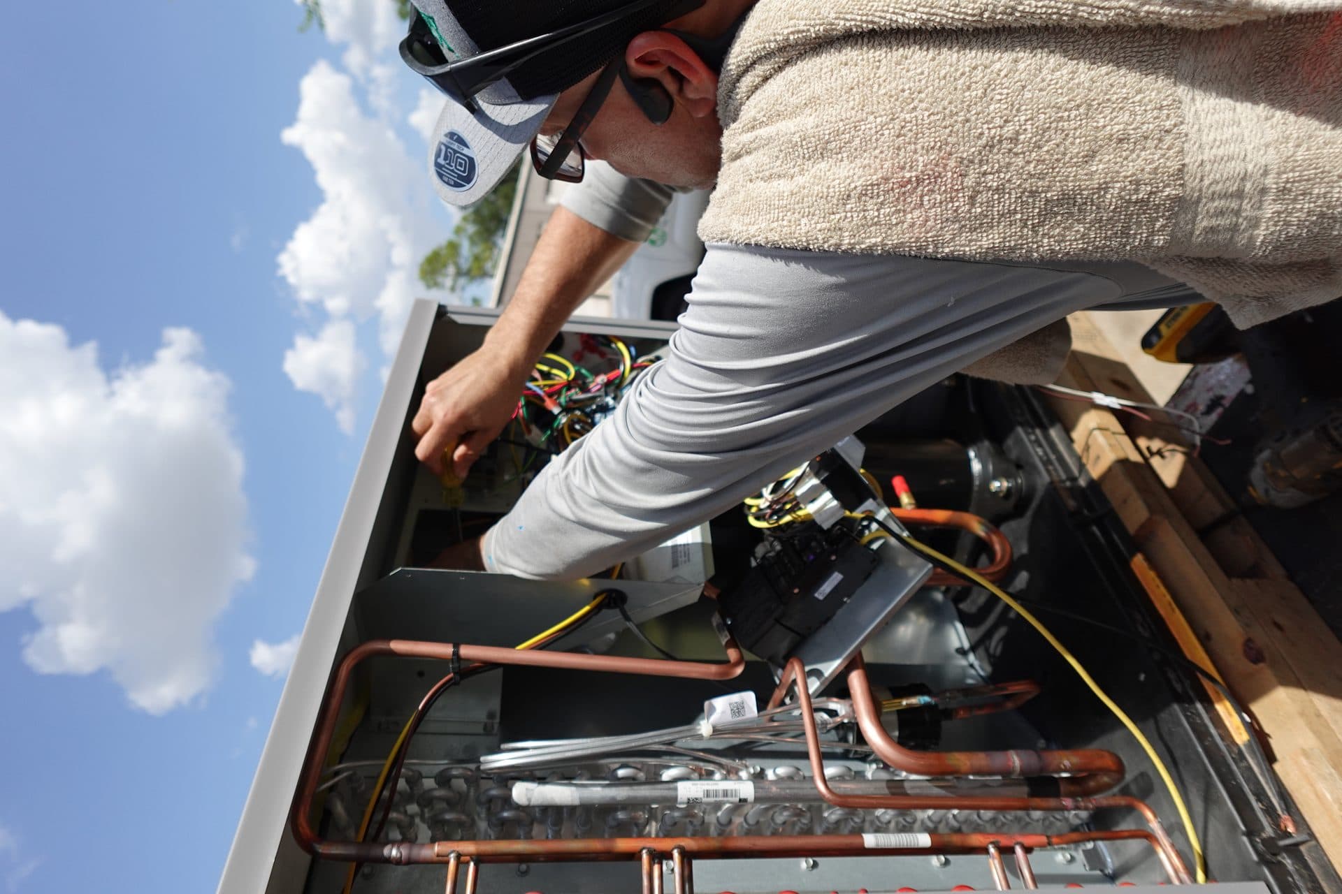 TruFlo technician repairing an air conditioning unit